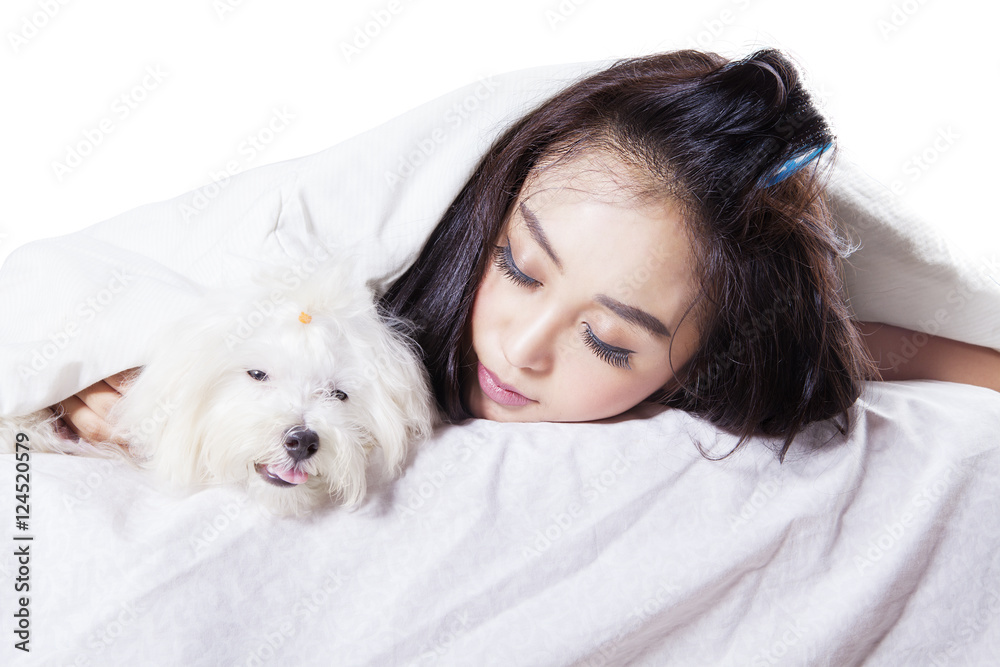 Girl sleeping with a dog under blanket Girl sleeping with a dog under blanket