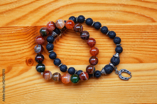 bracelets on the arm of the stones. Agate stone and lava stone.