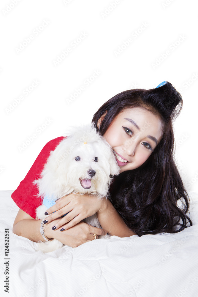 Woman hugging dog in studio Woman hugging dog in studio