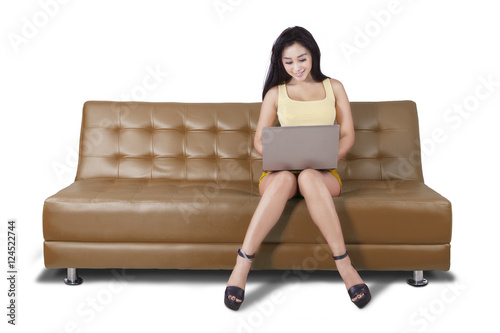 Free Download Woman typing on a laptop in the studio - GFXLoad