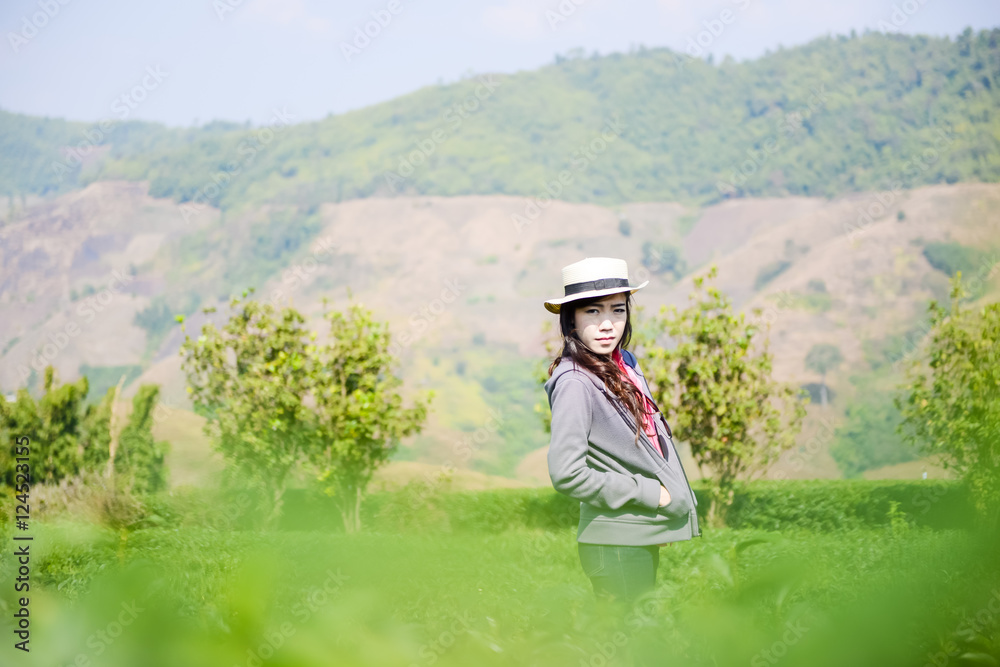 Portrait of happy woman relax in tea plantation Portrait of happy woman relax in tea plantation