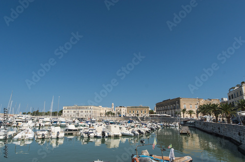 Boats moored in port. Trani. Apulia, Italy.
 photo