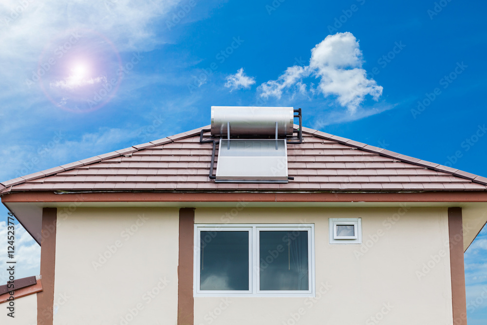 Solar panel for hot water system on roof on blue sky and sun Stock ...