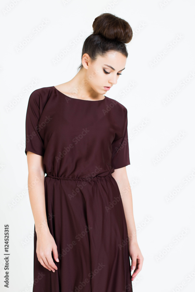Beautiful woman in Dress. Fashion. Isolated over white.