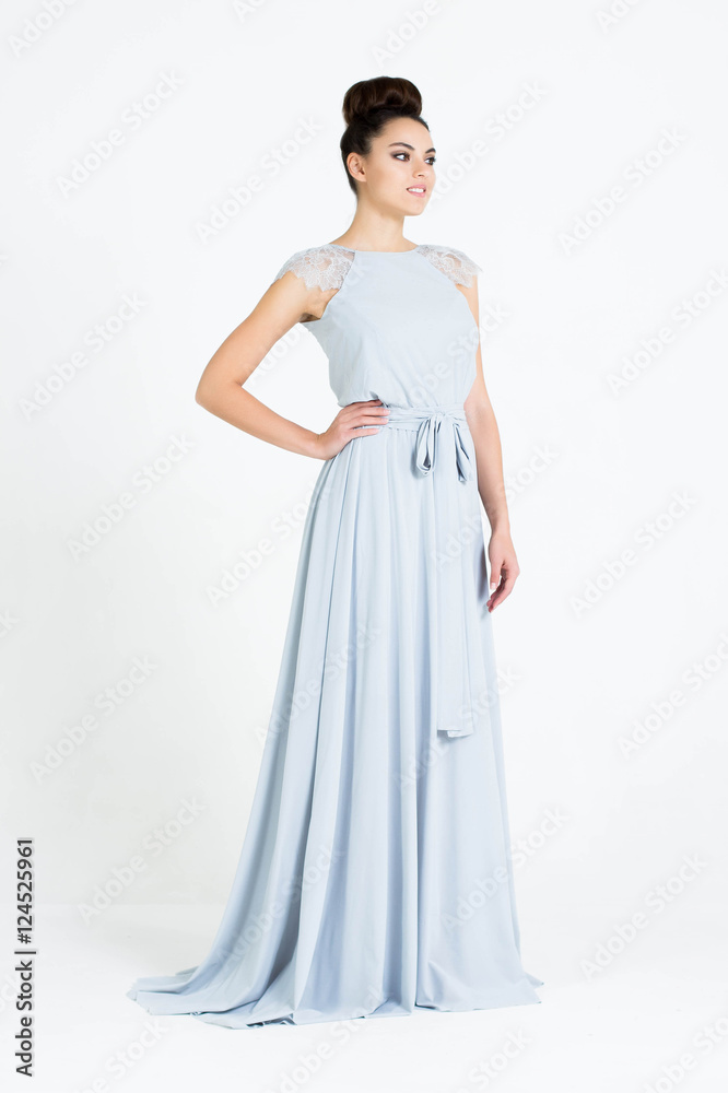 Beautiful woman in Dress. Fashion. Isolated over white.