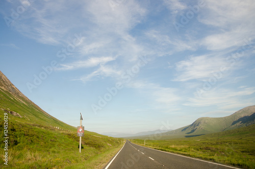 Front seat view of the Scottish Highlands and the road en route to Isle of Skye, Scotland, United Kingdom