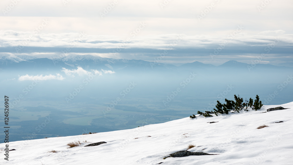 mountain tops in winter covered in snow mountain tops in winter covered in snow