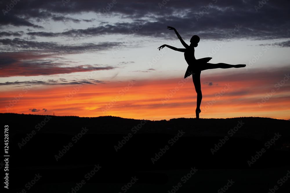 Ballet dancer posing during the sunset