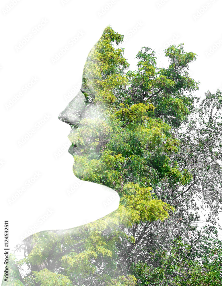 Double exposure of young beautiful girl among the leaves and trees Double exposure of young beautiful girl among the leaves and trees