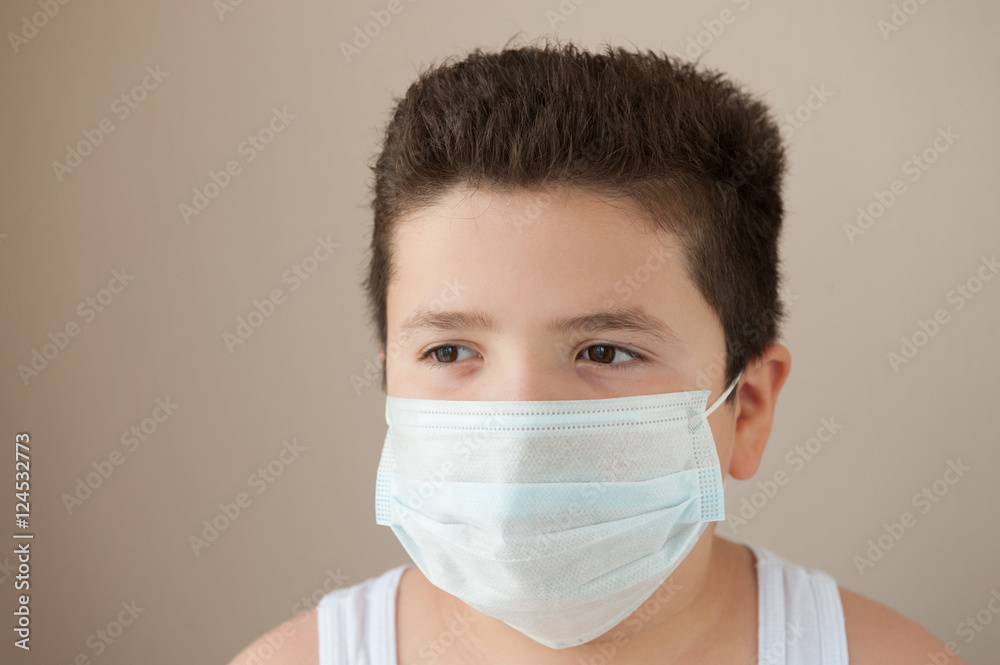 boy wearing a medical mask boy wearing a medical mask