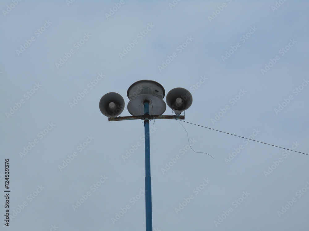 Two loudspeakers on a blue column Two loudspeakers on a blue column