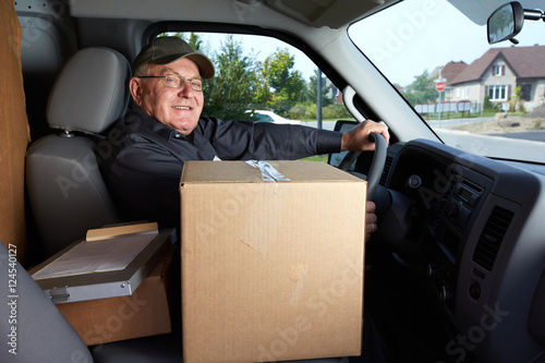 Mature delivery man with a parcel.