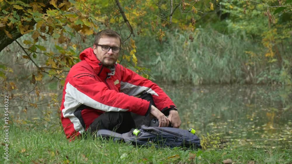 Man Puts on vr Headset Clicks the Phone Watching Video 360 Degrees in vr Glasses Playing Virtual Games Removes the Headset Looking at Water in Park Cloudy Man Puts on vr Headset Clicks the Phone Watching Video 360 Degrees in vr Glasses Playing Virtual Games Removes the Headset Looking at Water in Park Cloudy