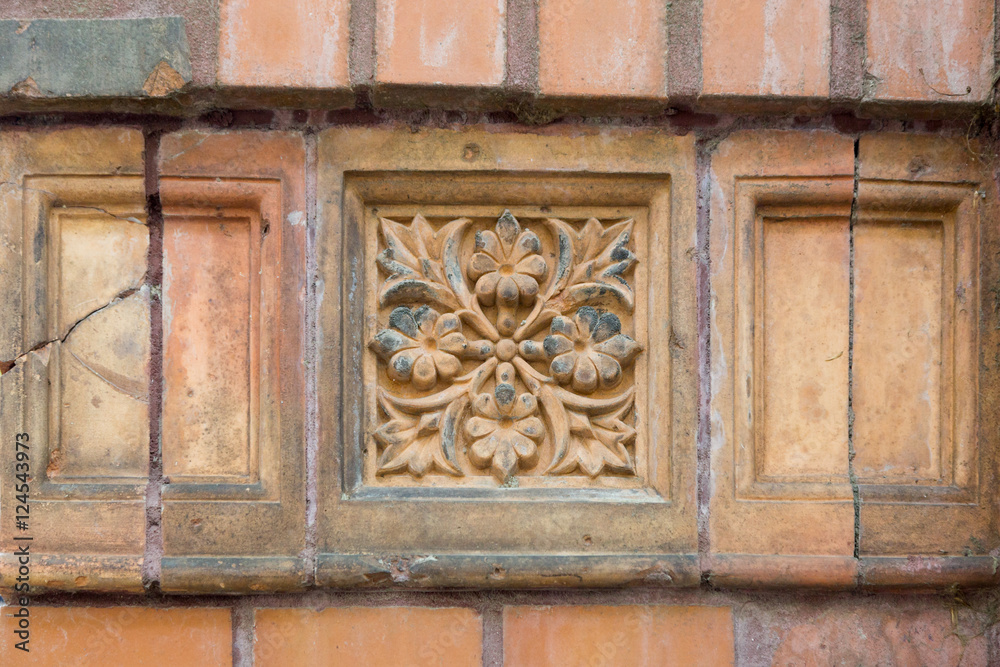 Old beatuiful ornamentic facade tile.