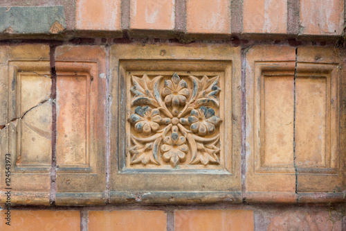 Old beatuiful ornamentic facade tile.