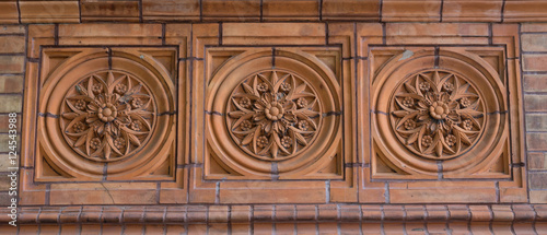 Old beatuiful ornamentic facade tile. photo