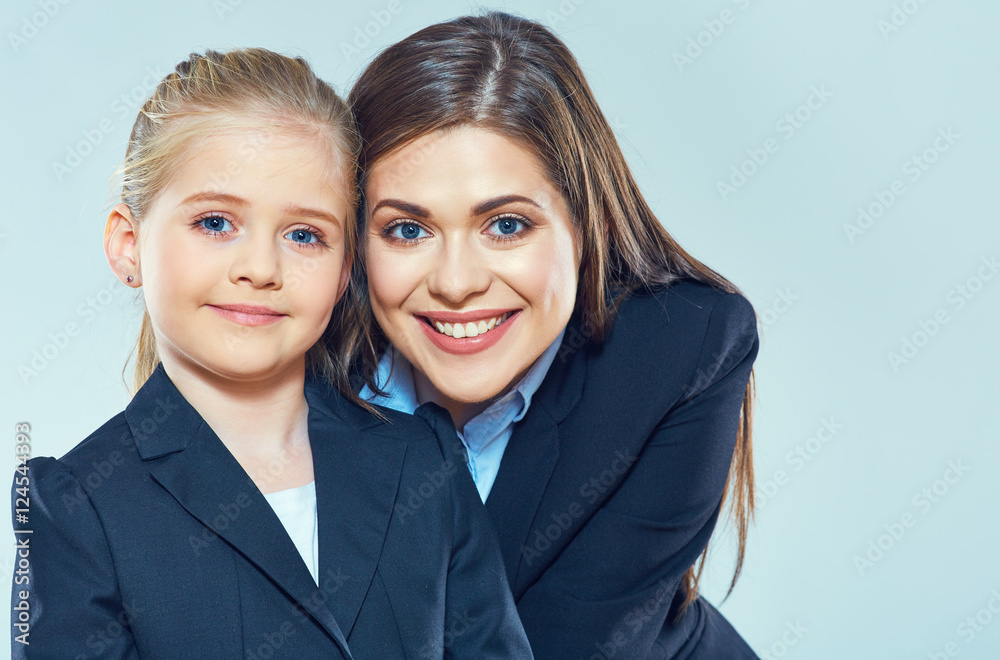 Little girl with business woman smiling face Little girl with business woman smiling face