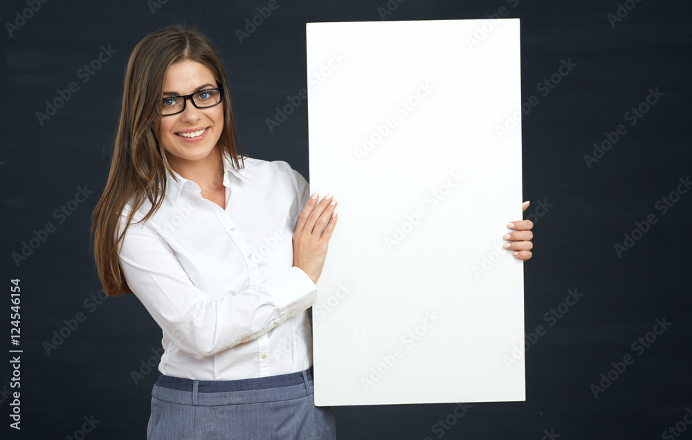 business woman holding white board show teeth with smile. business woman holding white board show teeth with smile.
