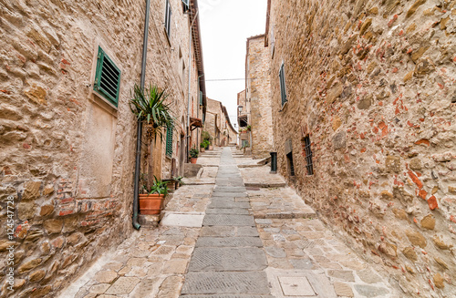 The narrow street in the historic center of Castiglione della Pescaia, Tuscany, Italy

