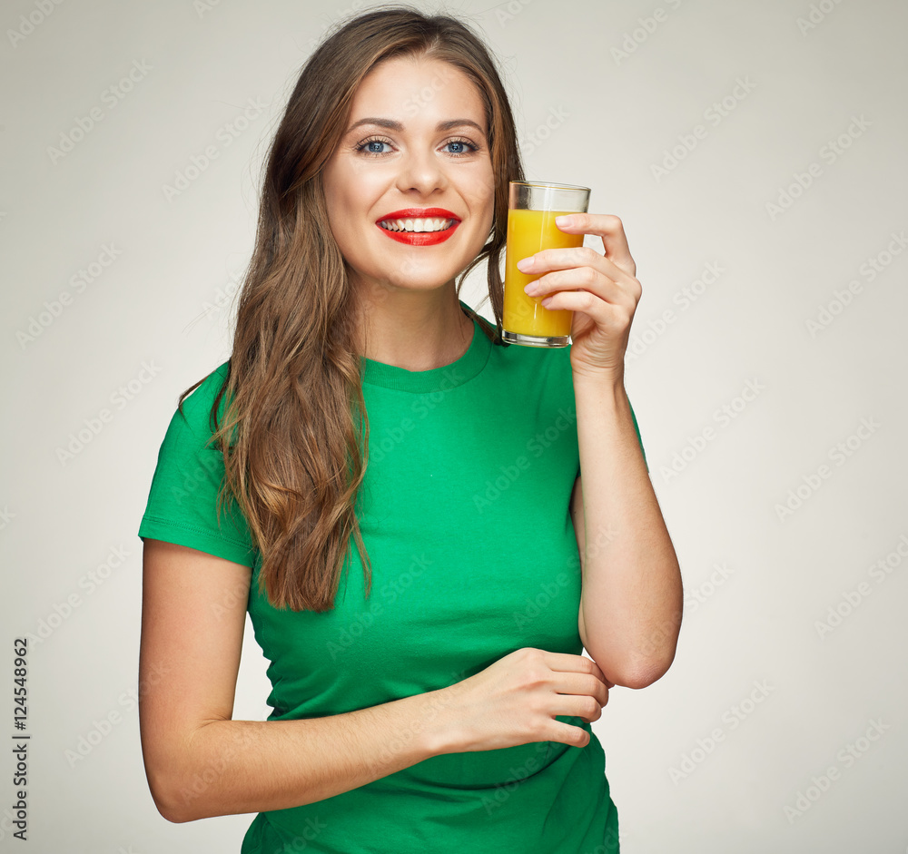 Young woman holding glass with orange juice. Young woman holding glass with orange juice.