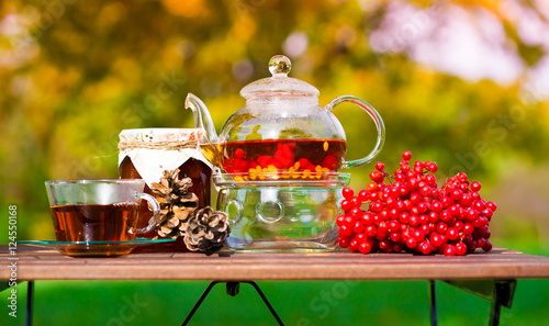 black tea with viburnum, fruit, garden