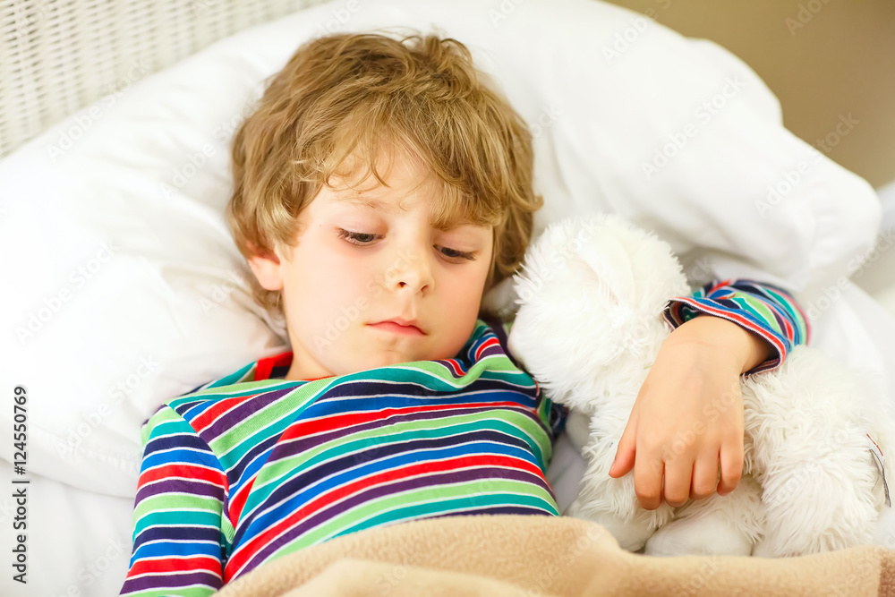 little blond kid boy in colorful nightwear clothes sleeping little blond kid boy in colorful nightwear clothes sleeping