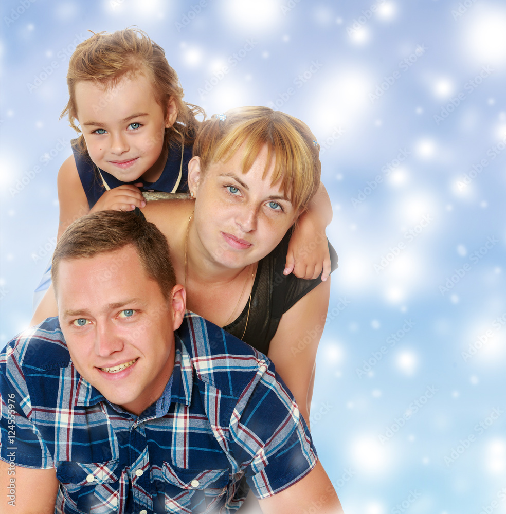 Fototapeta premium Mother and daughter sitting on dad's back.