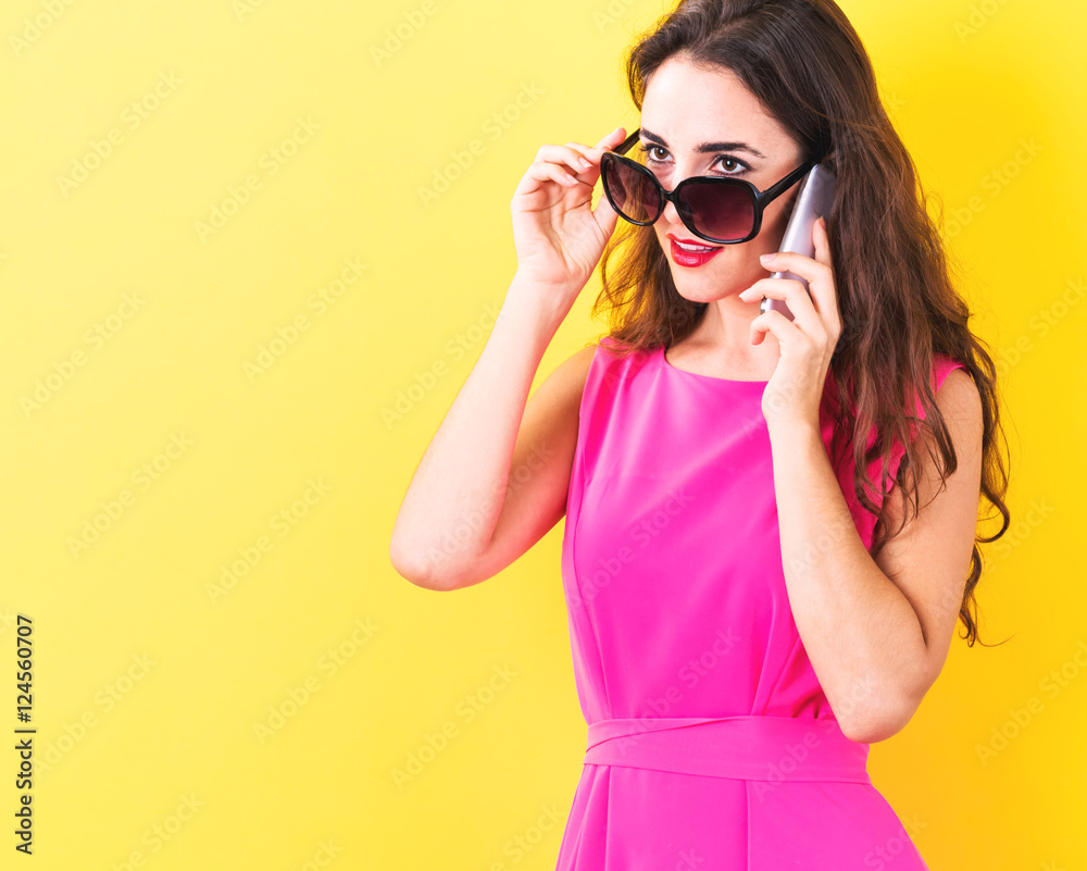 Young woman talking on the phone Young woman talking on the phone