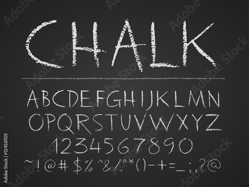 Uppercase letters, numbers and symbols hand drawn on chalkboard