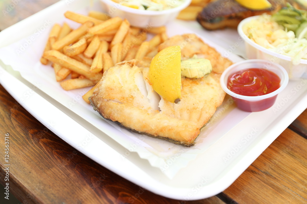 fried fish with lemon on top