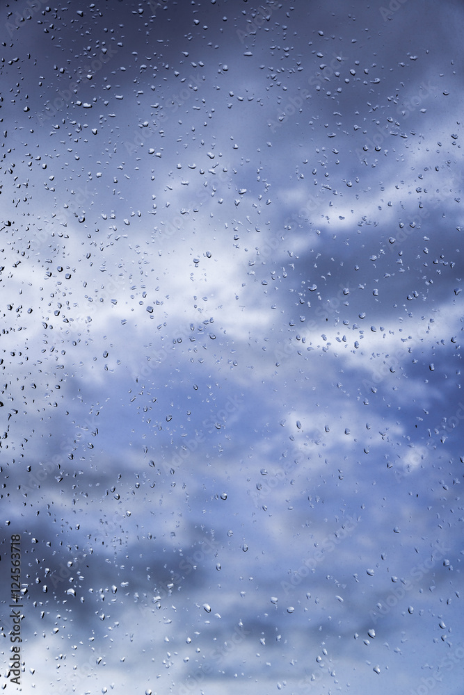 Rain / Water drop of rain on glass with outdoor background Rain / Water drop of rain on glass with outdoor background