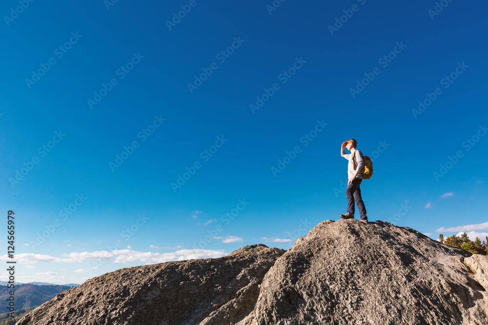 Man walking on the edge of a cliff Man walking on the edge of a cliff