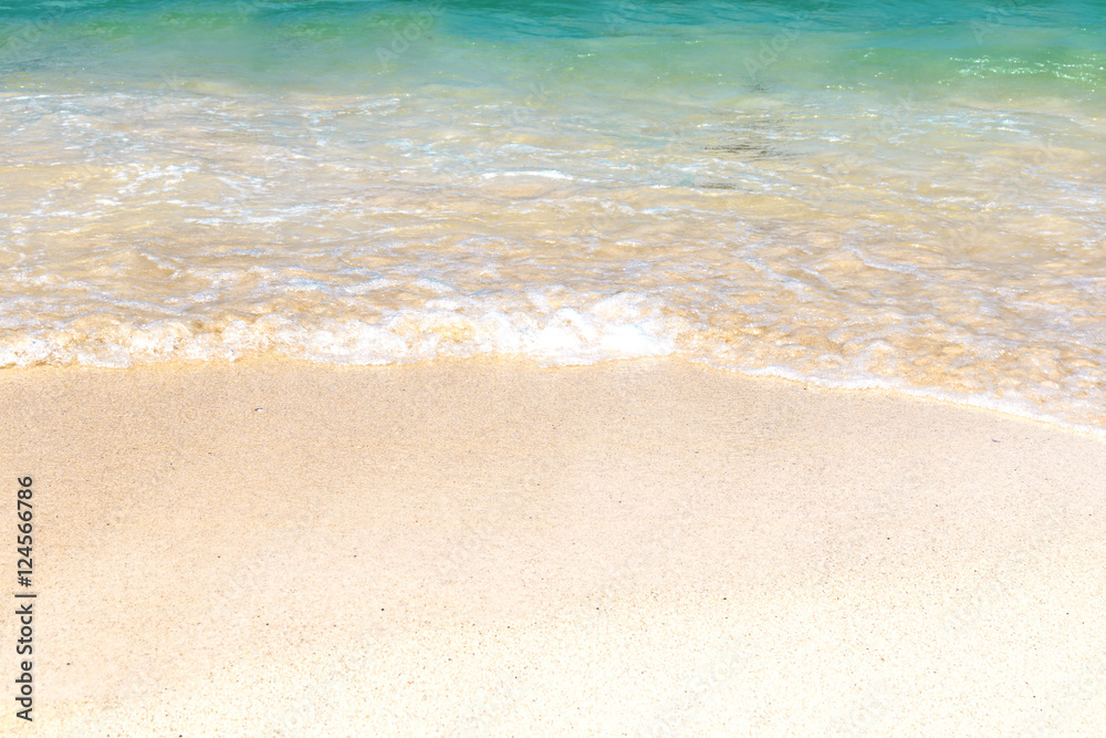 Wave of blue ocean on sandy beach. Background.