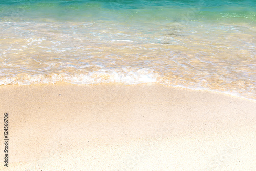 Wave of blue ocean on sandy beach. Background. © wutzkoh