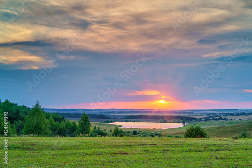 Beautiful sunset over lake in a countryside