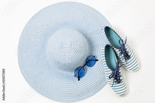 Fashion accessories in blue colors - hat, shoes and glasses.