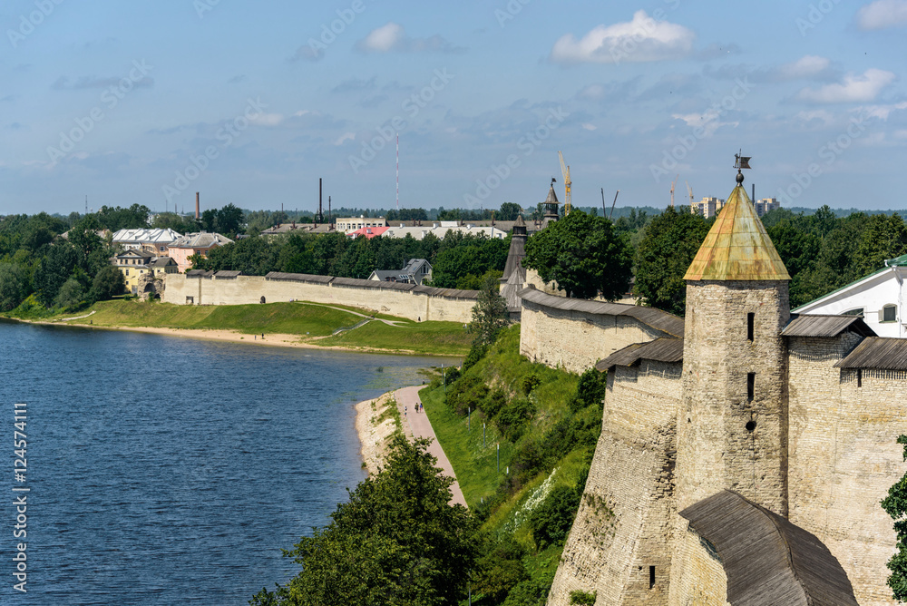 Walk along walls of the Pskov Kremlin in summer sunny day