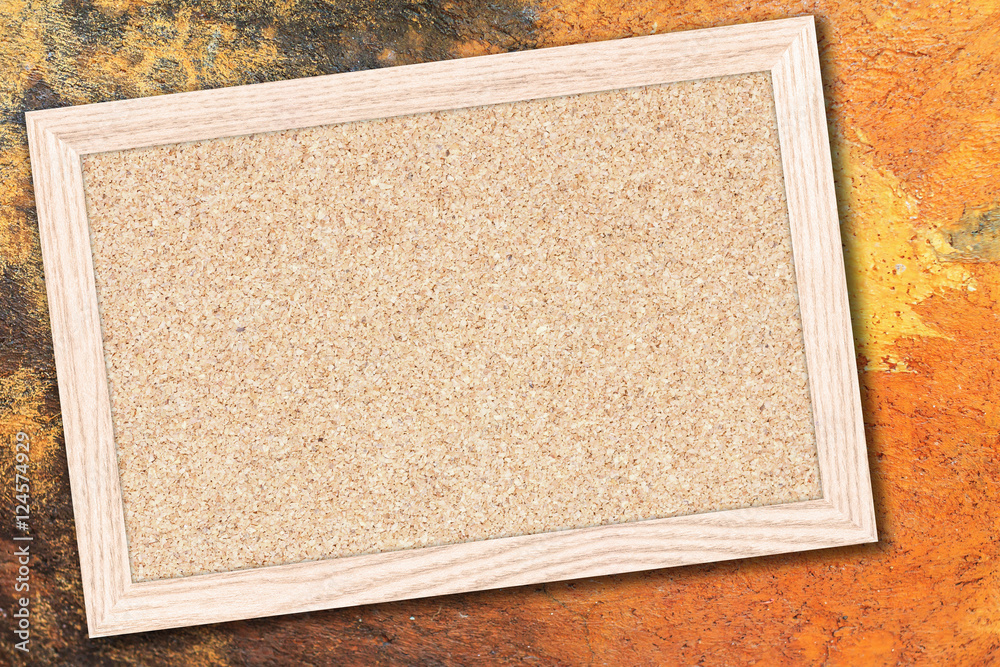 Fototapeta premium Cork board or Empty bulletin board with a wooden frame on cement wall background with copy space for text or image.