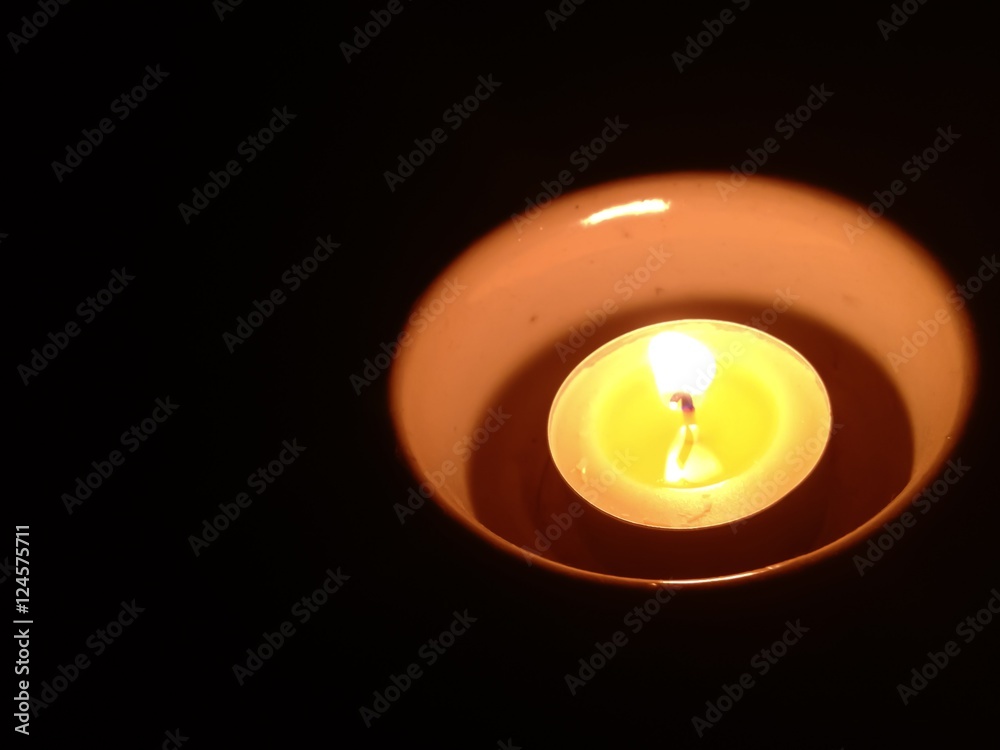 Candlelight in cup at the dark for Halloween. Candlelight in cup at the dark for Halloween.