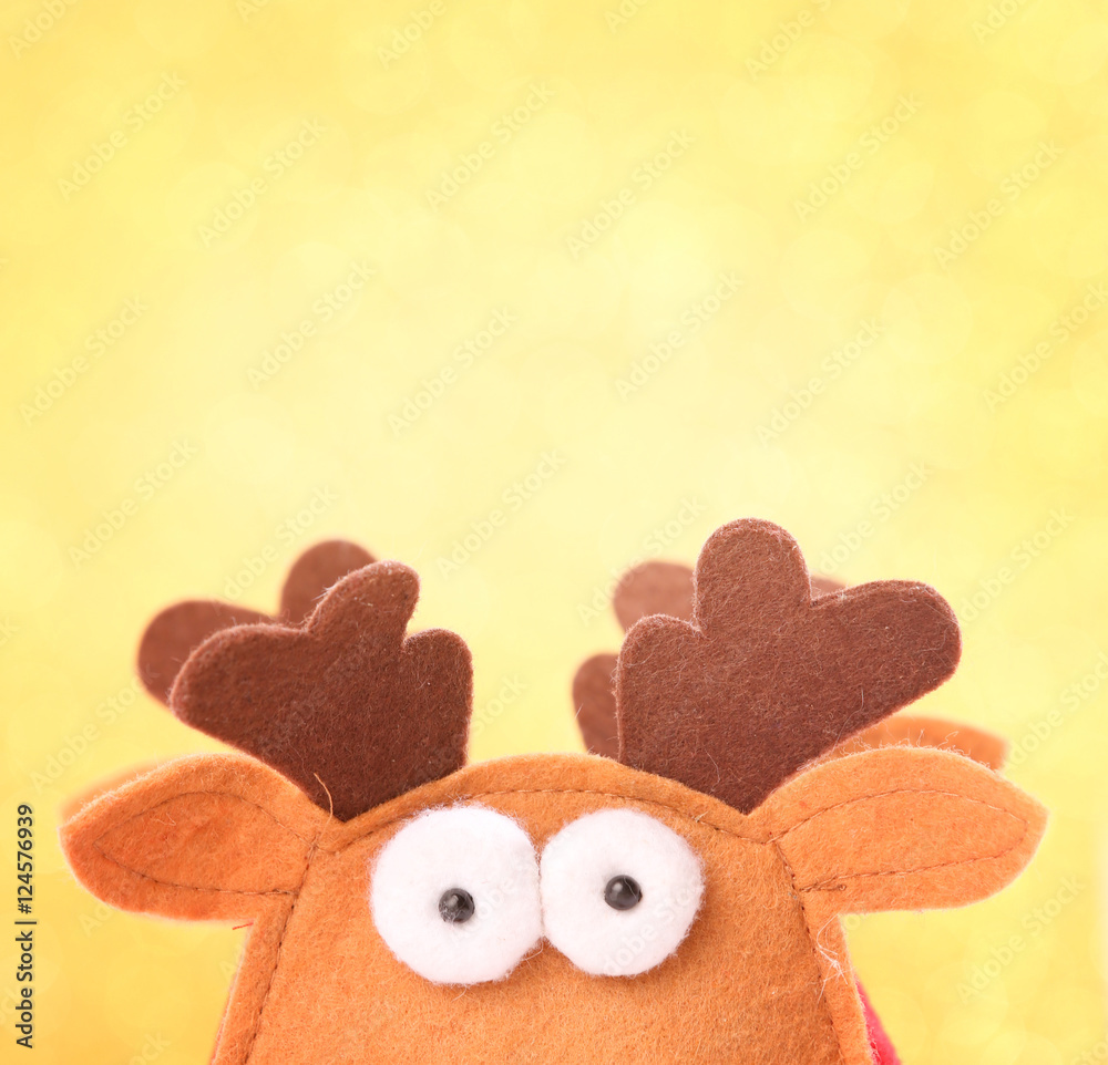 Christmas reindeer on golden bokeh background
Christmas reindeer on golden bokeh background