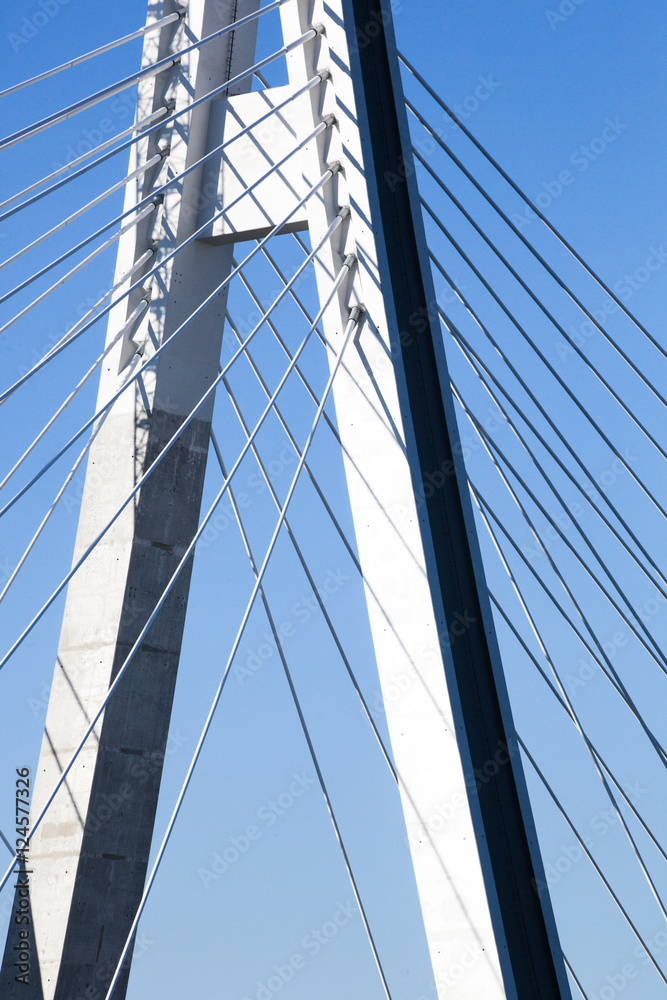 Fototapeta premium Construction of a new overhead bridge over the River with the flags of the European Union