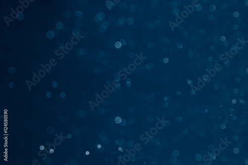 Принти на полотні Bokeh dark blue background with blurred rainbow lights