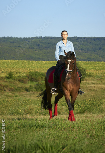 Enjoying horseback riding in nature © gzorgz