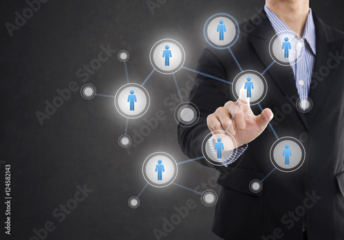 Businessman hand pressing icon on networking system concept technology people social network communication.