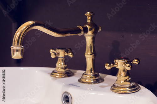 gold faucet and washbasin design retro vintage decorated luxury interior bathroom