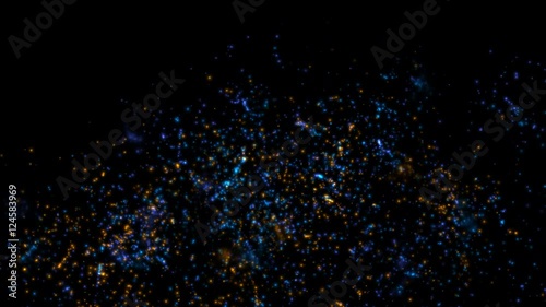 Sparks of blue and orange on a black background. Flash of blue and orange sparks. photo