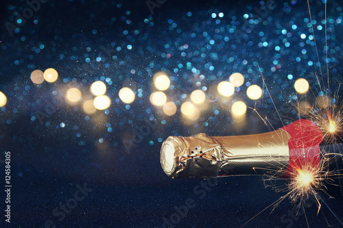 Abstract image of champagne bottle and festive lights © tomertu