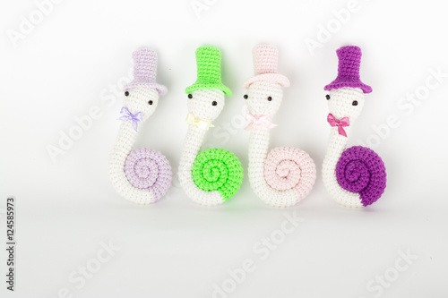 soft toy crochet in the form of a snail in a cap