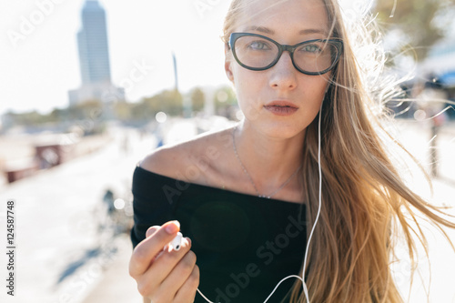 Woman listening music with earphones