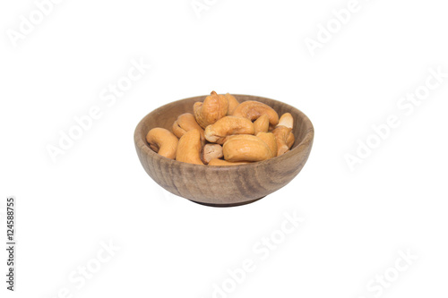 cashew nut in wood bowl on white